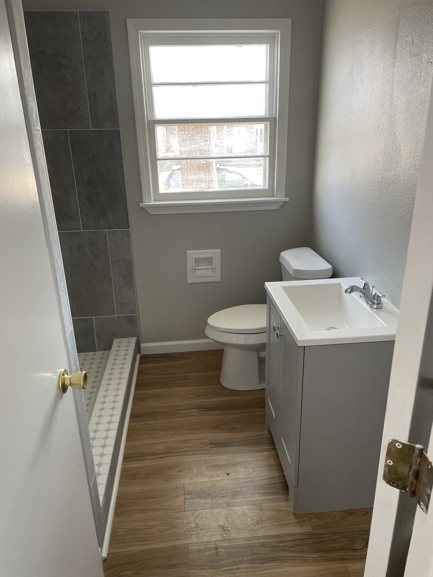 Slate-tile bathroom with hex floor